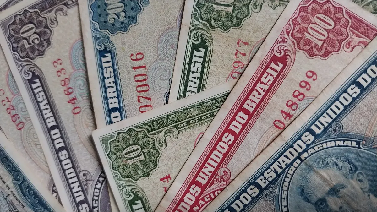 Close-up of vintage Brazilian banknotes, featuring intricate designs and historical value.