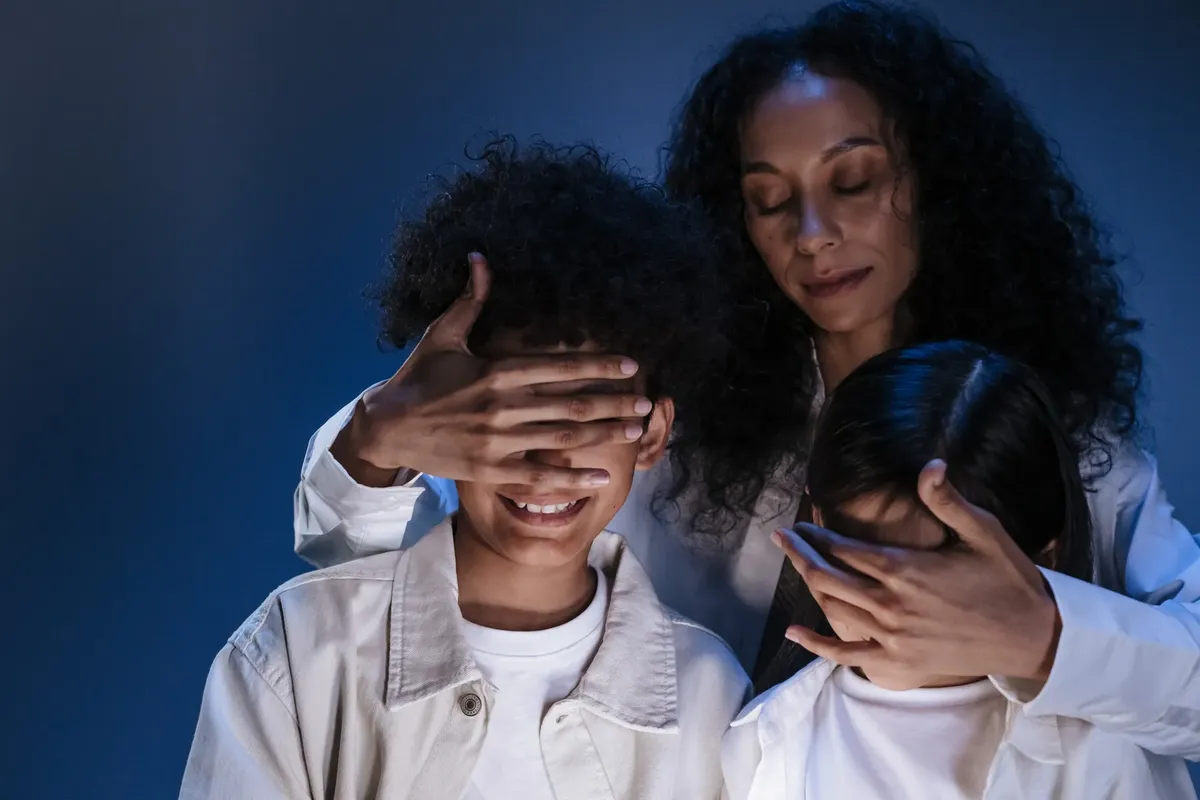 Mother guides her children with love and protection, symbolizing online safety and privacy.