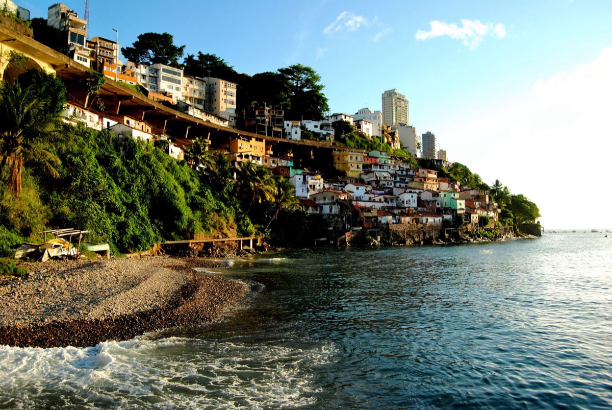 Brazilian favela with makeshift medical tent highlighting health disparities in Brazil